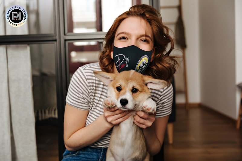 Woman with dog wears Asher Mask